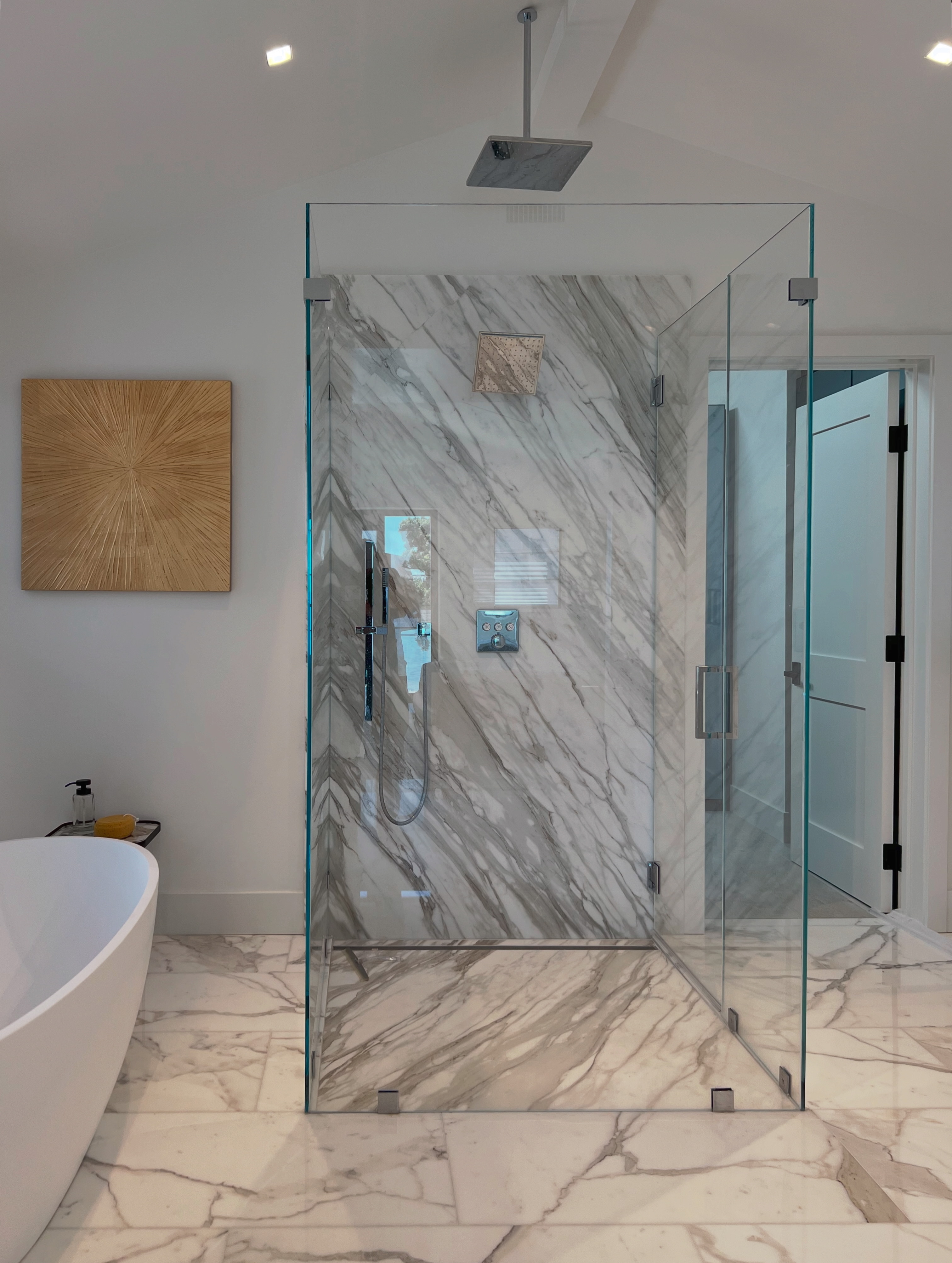 Primary bath frameless shower and double vanity